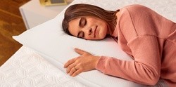 Woman laying on pillow on a Cocoon mattress