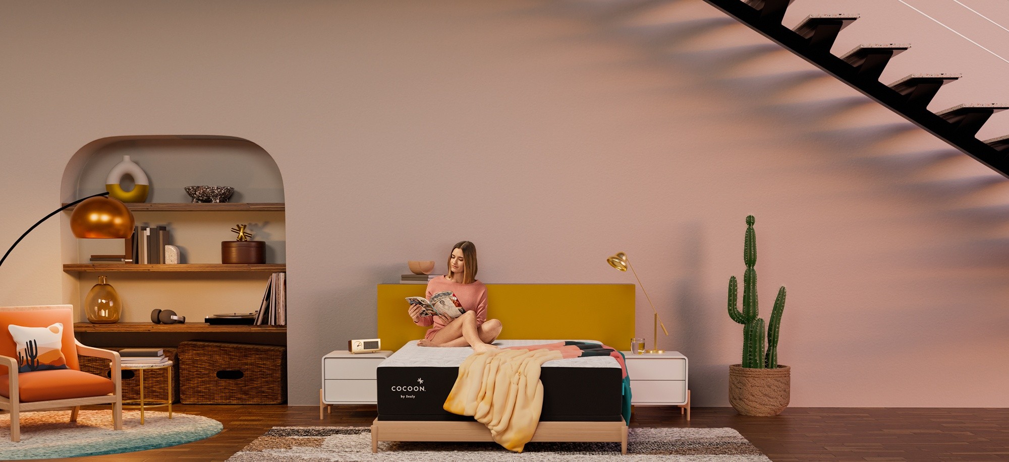 Woman sitting on Cocoon mattress in styled room reading