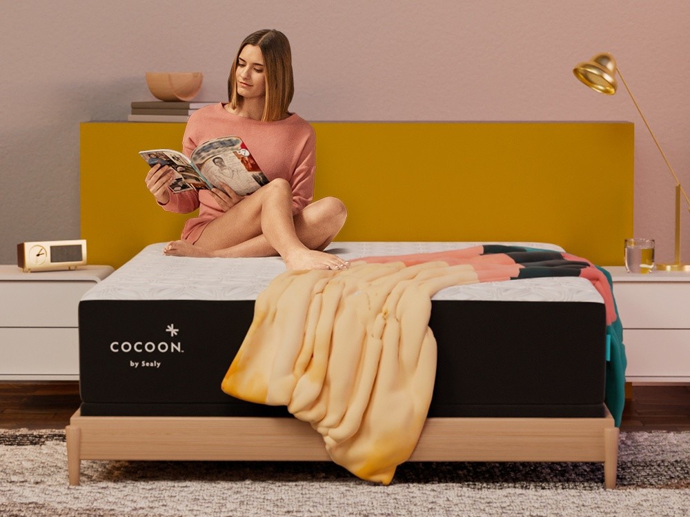 woman reading a magazine in bed